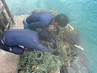 RMCG members pulling ghost net out from the sea